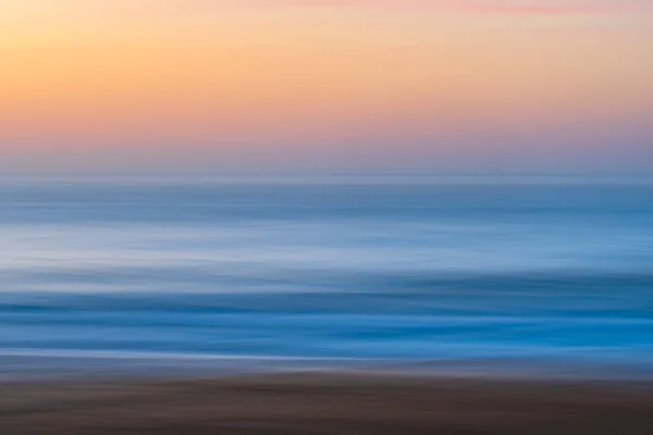 stock image Panning sunrise seascape from Killcare Beach on the Central Coast, NSW, Australia.