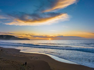 Sunrise seascape with colour and clouds at Killcare Beach on the Central Coast, NSW, Australia.
