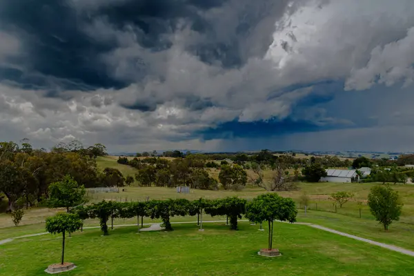 stock image Early evening Summer Storm approaching over the fields on a rural property at Blayney in the Central West of NSW, Australia.