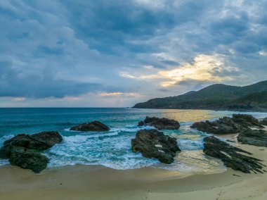 Cloudy sunrise seascape at Burgess Beach on the Barrington Coast at Forster-Tuncurry, NSW, Australia clipart