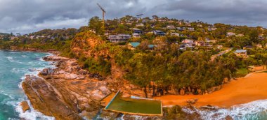 Aerial sunrise panorama over Whale Beach in the Northern Beaches region of Sydney, NSW, Australia. clipart