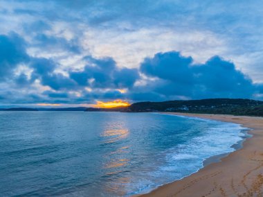 Sunset with high cloud at Putty Beach on the Central Coast, NSW, Australia. clipart