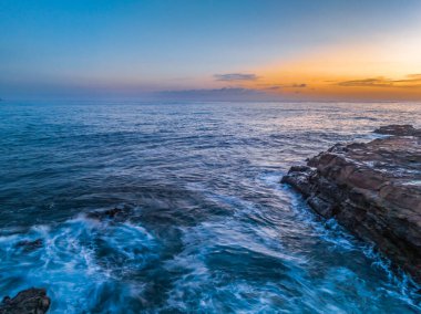 Sunrise at the seaside from Avoca Beach on the Central Coast, NSW, Australia. clipart