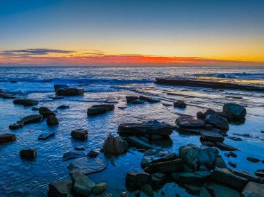 Aerial sunrise seascape with low cloud bank at The Skillion in Terrigal, NSW, Australia. clipart