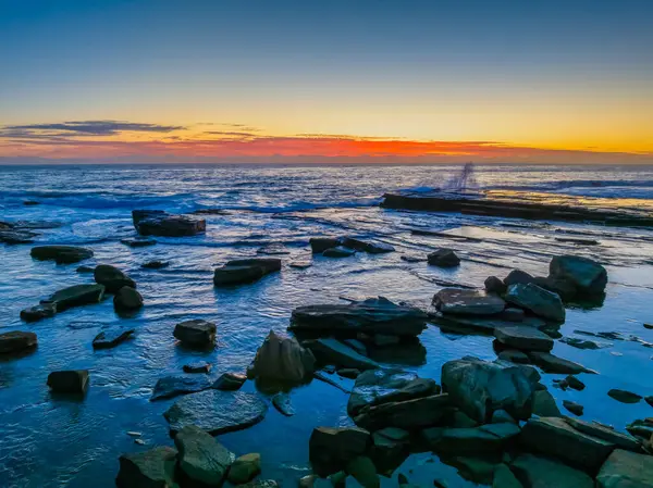 stock image Aerial sunrise seascape with low cloud bank at The Skillion in Terrigal, NSW, Australia.