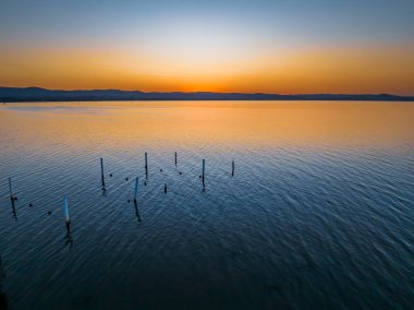 Long Jetty 'deki Tuggerah Gölü üzerinde gün batımı, Central Coast, NSW, Avustralya