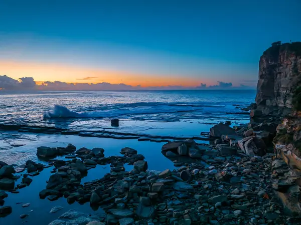 stock image Aerial sunrise seascape from the rocky inlet known as The Skillion in Terrigal, NSW, Australia.