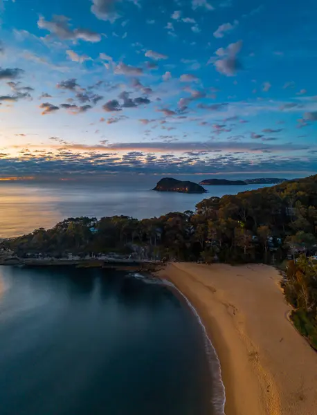 Stock image Sunrise with clouds over Pearl Beach on the Central Coast, NSW, Australia.