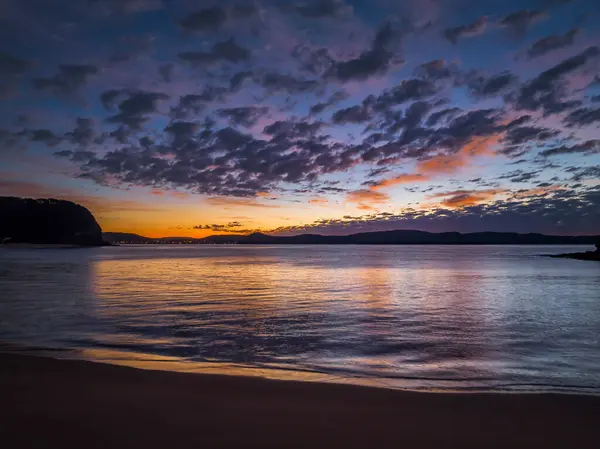 stock image Sunrise with clouds over Pearl Beach on the Central Coast, NSW, Australia.