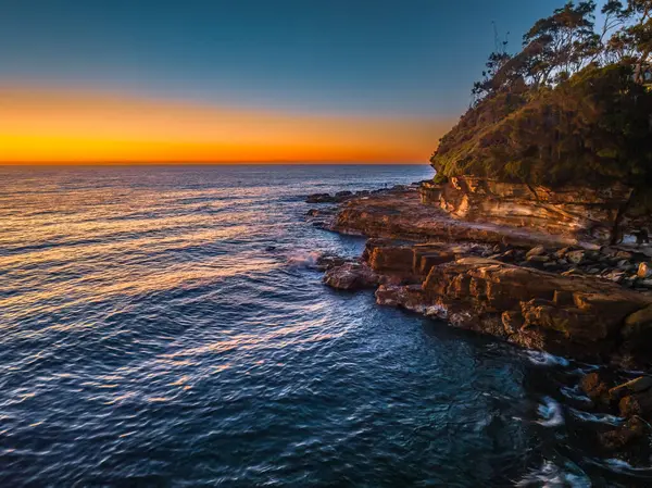 stock image Sunrise seascape with clear skies at Avoca Beach on the Central Coast, NSW, Australia.