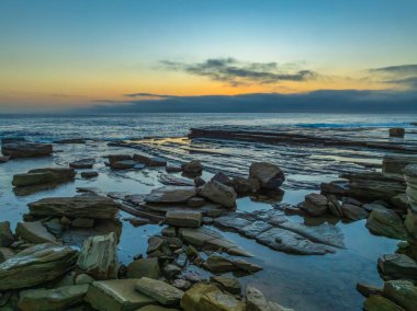 Aerial sunrise seascape with thick fog cloud at The Skillion in Terrigal, NSW, Australia. clipart