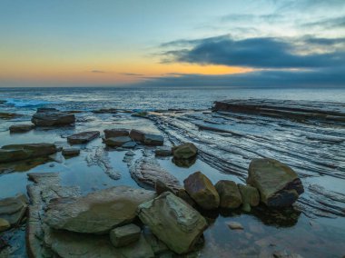 Aerial sunrise seascape with thick fog cloud at The Skillion in Terrigal, NSW, Australia. clipart