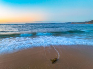 Sunrise at the seaside from  Putty Beach n Bouddi National Park at Killcare Heights on the Central Coast, NSW, Australia. clipart