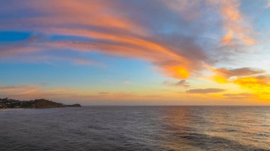 Scenic sunrise seascape with clouds and fog at Avoca Beach on the Central Coast, NSW, Australia. clipart