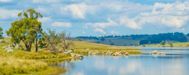 Scenic views over Lake Oberon which supplies drinking water and is ideal for canoes, kayaks and small fishing or sailing dinghies which are electric powered.  clipart