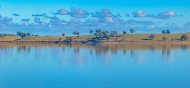 Cairn Curran Reservoir is is a recreational and irrigation weir situated along the Loddon River near the townships of Baringhup, Newstead and Welshmans Reef in Victoria, Australia. clipart