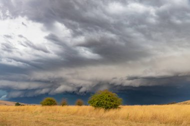 Evening storms passing over the countryside at Blayney in the Central West of NSW, Australia. clipart