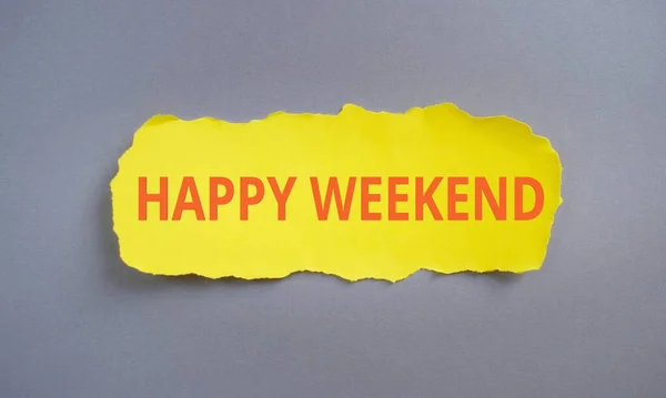 Happy Weekend text written on yellow torn papper, Business concept,gray background.