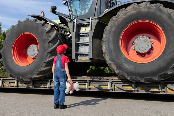 Child Examines Huge Tractor Large Wheels Loaded Truck Transportation Unrecognizable Stock Photo