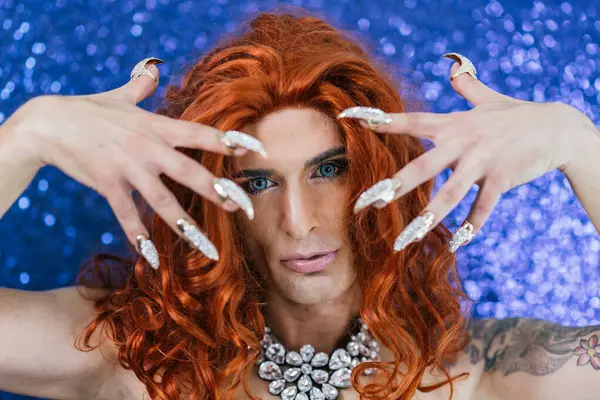 stock image Frontal close-up photo of a drag queen showing the fake bright nails on stage