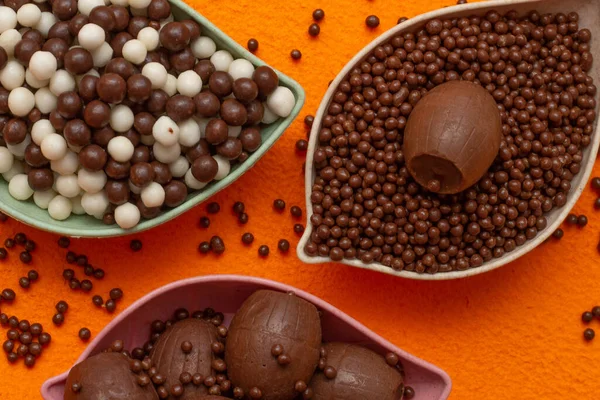 stock image baskets of chocolate balls on an orange background