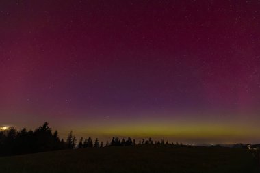 fantastic Northern Lights over Moeggers in Vorarlberg, Austria clipart