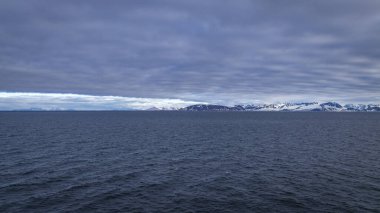 cruising on Svalbard between Spitsbergen and Nordaustlandet anlong glacier clipart