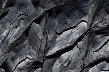 Soyut arkaplan materyali kaya kayası dokusu zemin ve duvar kağıdı için kaba siyah ve gri.