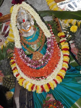 Bangalore, Karnataka, India-Aug 05, 2022: Closeup of beautiful goddess Vara Mahalakshmi decoration with flowers, fruits