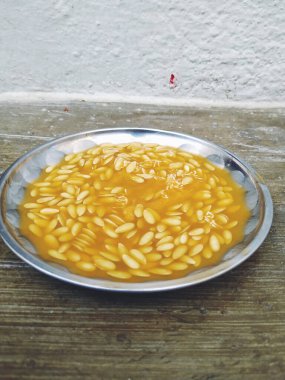 Muskmelon Meyve Tohumları Çelik Tabakta Grubu 'nun yakın çekimi. Misk karpuzu tohumu dokusu