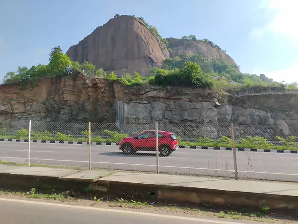 stock image Ramanagara, Karnataka, India-June 2 2024: Closeup of beautiful Hill view from roadside from Mysuru and Bengaluru expressway near the Ramanagara.