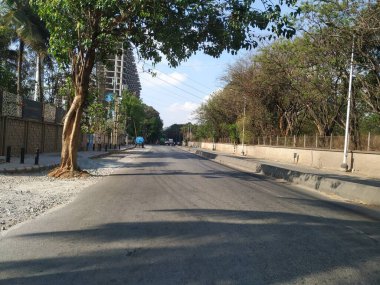 Bangalore, Karnataka, India-April 20 2020: Closeup of beautiful asphalt road view of BMTC Bus Routes from Goraguntepalya to Hebbal. clipart