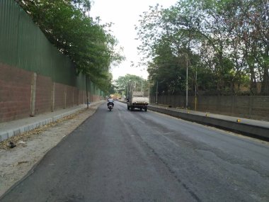 Bangalore, Karnataka, India-April 20 2020: Closeup of beautiful asphalt road view of BMTC Bus Routes from Goraguntepalya to Hebbal. clipart