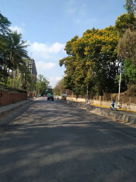 stock image Bangalore, Karnataka, India-April 20 2020: Closeup of beautiful asphalt road view of BMTC Bus Routes from Goraguntepalya to Hebbal.