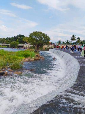 Srirangapatna, Karnataka, India-Oct 12, 2024: Closeup of beautiful Tourists usually visit Balmuri Falls and Lord Shiva temple. clipart