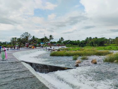 Srirangapatna, Karnataka, India-Oct 12, 2024: Closeup of beautiful Tourists usually visit Balmuri Falls and Lord Shiva temple. clipart