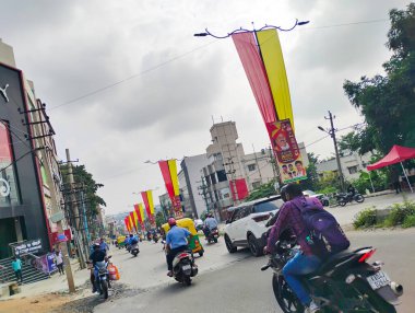 Bangalore, Karnataka, India-November 4, 2024: Beautiful decoration using yellow and red color cloth to celebrate Kannada Rajyotsava on roadside of the Nagarabhavi. clipart