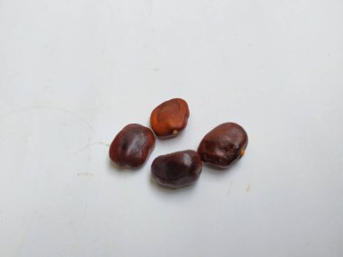 Tamarind Meyve Tohumları Yığını ve deseni beyaz arkaplanda izole edilmiş..