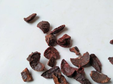 Adike ya da Areca 'ya yakın plan beyaz arkaplanda izole edilmiş desen ve dokuyu dilimler.