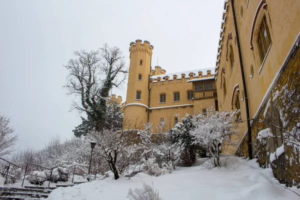 stock image Hohenschwangau Castle in the middle of winter full of snow. Hohenschwangau Castle is located directly opposite Neuschwanstein Castle in Schwangau, Bavaria.