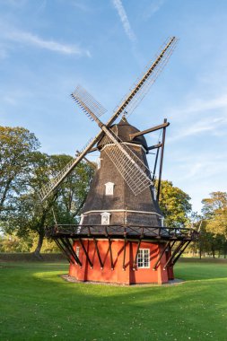 old wooden windmill in the park clipart