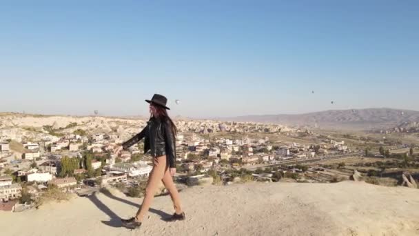 Young Woman Hat Black Jacket Walking Sunset Valleys Cappadocia Turkish — Stockvideo