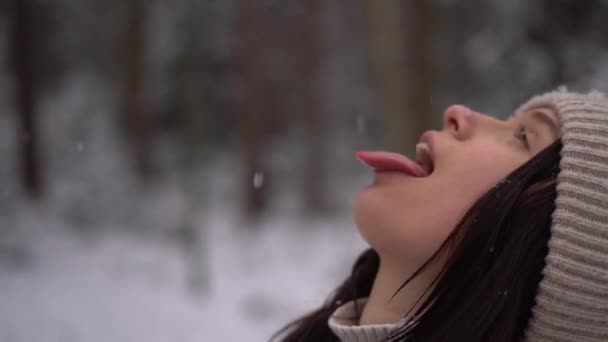 Cute Teenage Girl Catching Snowflakes Her Tongue Outdoors Beige Hat — Stock Video