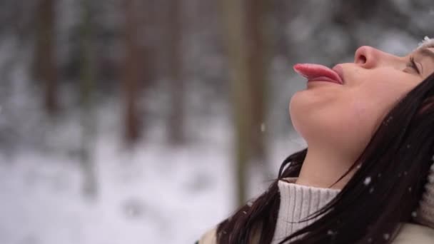 Cute Girl Catching Snowflakes Her Tongue Outdoors Beige Hat Austria — Wideo stockowe