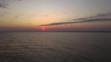 Aerial view of sea at sunset time, drone footage, background. High quality FullHD footage