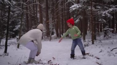 Footage of Playful Teens Throwing Snow At Each Other . High quality 4k footage