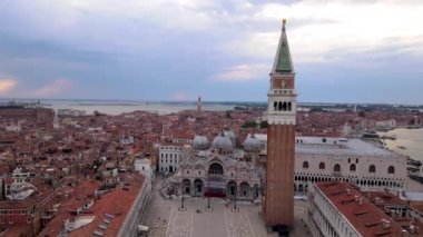 Zoom out aerial view of St. Marks square, Venetian Lagoon, Venice canals. sunset time, Italy, 4k video. High quality 4k footage