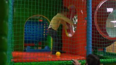 A boy playing with a ball in the childrens room. High quality FullHD footage