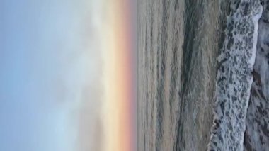 Mariupol, Ukraine - 04.10.2022: Huge amount of smoke from destroyed Mariupol against the background of the sea. High quality FullHD footage