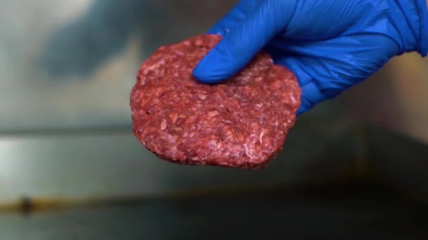 Hand Blue Glove Puts Burger Patty Hot Stove Close View — Vídeo de Stock